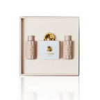 Amouage Honour Woman Eau de Parfum Geschenkset mit Flakon, Body Lotion und Bath & Shower Gel auf weißem Hintergrund.